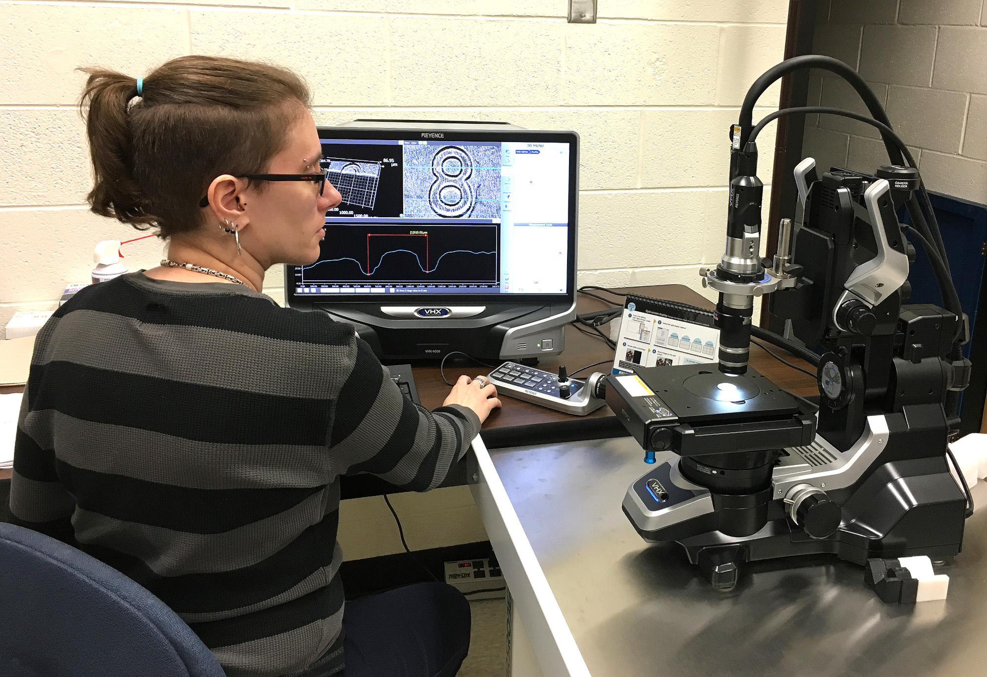 Amy Albin operating the VHX-6000 microscope