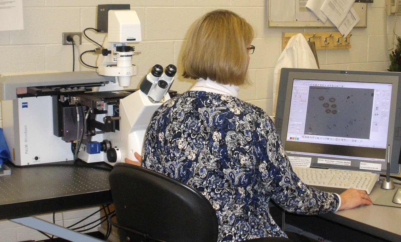 Dr. Melinda Frame operating the Zeiss Palm LCM system